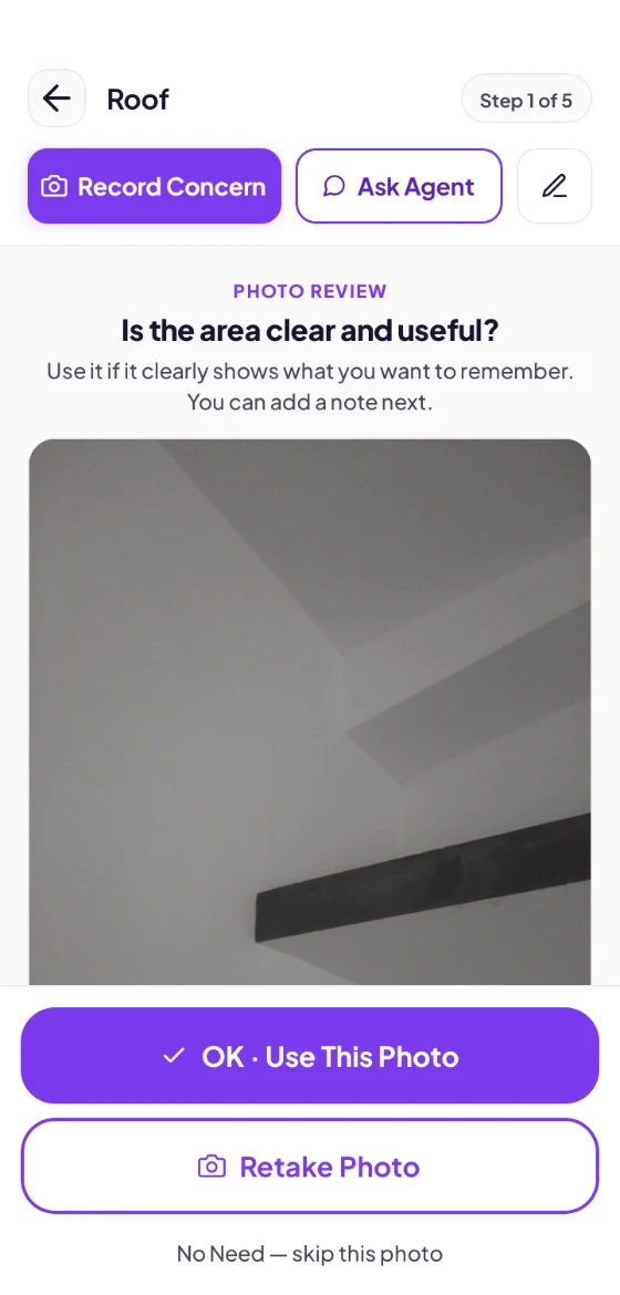 Reviewing a photo of a roof beam before saving it to a concern